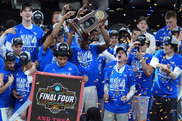 Florida players celebrate after their win against Texas Tech in the Elite Eight of the NCAA college basketball tournament, Saturday, March 29, 2025, in San Francisco. (AP Photo/Marcio Jose Sanchez)