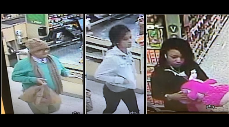 Three suspects (pictured) allegedly worked together to take a Publix shopper's wallet while she was distracted, Gwinnett County police say.