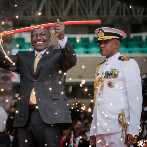 FILE - Kenya's new president William Ruto holds up a ceremonial sword as he is sworn in to office at a ceremony held at Kasarani stadium in Nairobi, Kenya Tuesday, Sept. 13, 2022. (AP Photo/Brian Inganga, File)