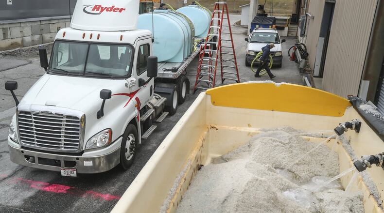 GDOT worker, Mike Jett prepare a brine truck for service at the Georgia Department of Transportation unit at 25 Kennedy Road in Forest Park on Friday, Dec. 7, 2018. When a complex of storms bring inches of heavy rain to North Georgia this weekend, some areas in the northeast corner of the state could see snow and ice. JOHN SPINK/JSPINK@AJC.COM AJC FILE PHOTO