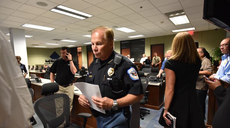 Cobb County Police Chief Mike Register enters the room for a press conference at Emergency Operations Center in Marietta on Thursday, August 31, 2017. HYOSUB SHIN / HSHIN@AJC.COM