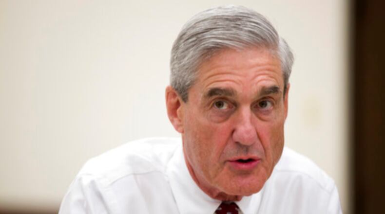 FILE - In this Aug. 21, 2013, file photo, then-FBI director Robert Mueller speaks during an interview at FBI headquarters in Washington. The Justice Department on May 17, 2017, appointed Mueller as a special counsel to oversee a federal investigation into potential coordination between Russia and the Trump campaign during the 2016 presidential election. (AP Photo/Evan Vucci, File)