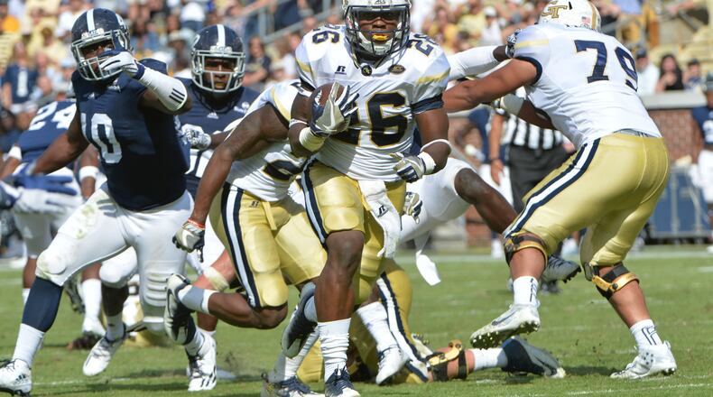 Georgia Tech running back Dedrick Mills (26) breaks away for a go-ahead touchdown in the second half at Bobby Dodd Stadium on Saturday, October 15, 2016. HYOSUB SHIN / HSHIN@AJC.COM