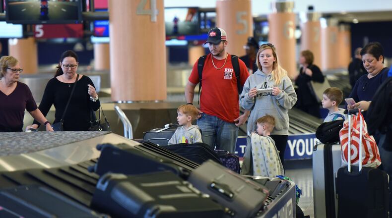 March 8, 2016 Atlanta - Travelers wait for their baggages at domestic terminal of Hartsfield-Jackson International Airport on Tuesday, March 8, 2016. or years, Hartsfield-Jackson Atlanta International Airport boasted about how it was the world's busiest airport. Then a colleague of mine learned airport marketers and pr folks dropped the "b" word after finally coming to grips with the idea that maybe it isn't actually a positive in the minds of travelers who deal with all the ramifications of "busy". The pros at the airport came up with another descriptor to use when boasting and talking trash: world's "most traveled airport." HYOSUB SHIN / HSHIN@AJC.COM