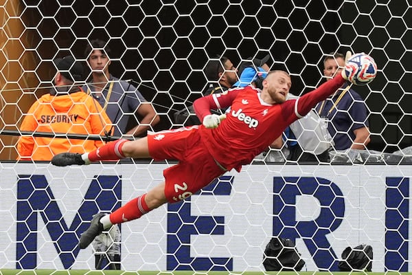 Juventus' Michele Di Gregorio saves during the Club World Cup round of 16 soccer match between Real Madrid and Juventus in Miami Gardens, Fla., Tuesday, July 1, 2025. (AP Photo/Rebecca Blackwell)