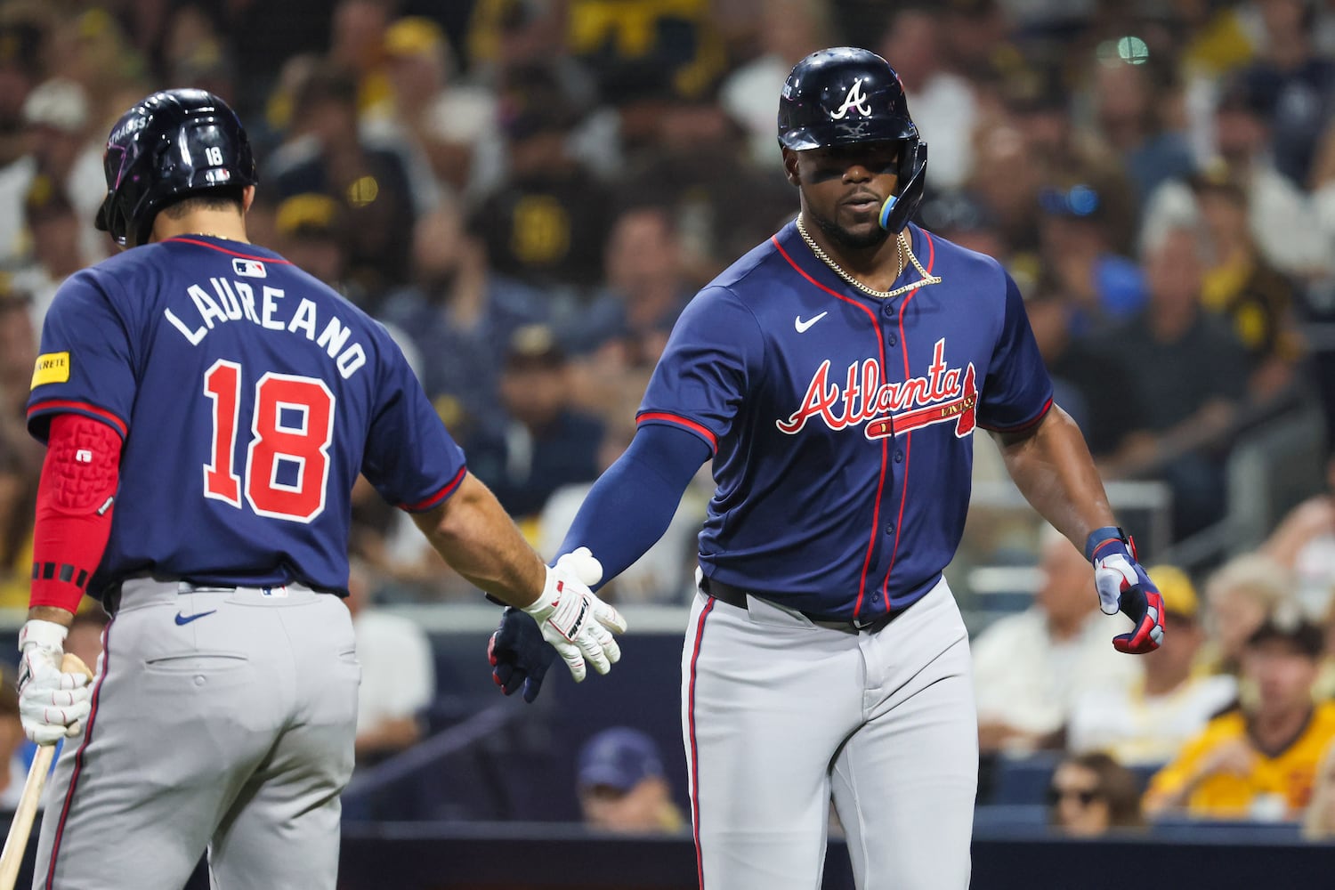 Atlanta Braves’ Jorge Soler is greeted by Ramón Laureano (18) after a solo homer against the San Diego Padres during the fifth inning of National League Division Series Wild Card Game Two at Petco Park in San Diego on Wednesday, Oct. 2, 2024.   (Jason Getz / Jason.Getz@ajc.com)