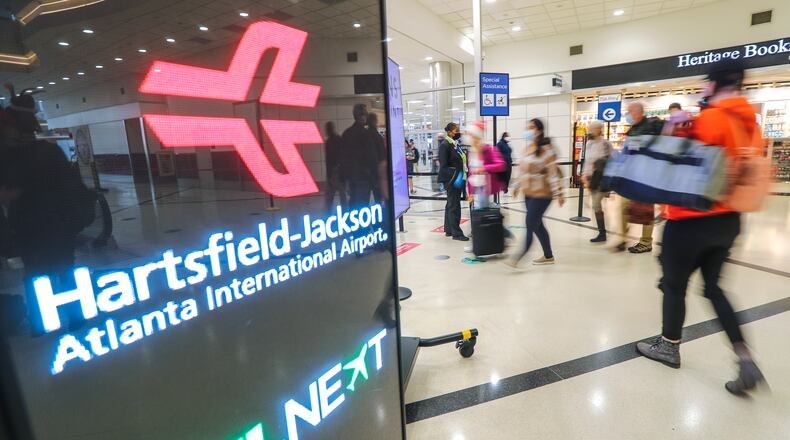 Travelers on Wednesday, Nov. 17, 2021, as Hartsfield-Jackson International Airport gears up for holiday travel with Thanksgiving around the corner. (Photo:  John Spink / John.Spink@ajc.com)