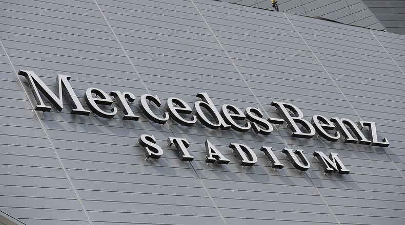June 1, 2017, Atlanta: A iron worker is seen at the edge of the roof as construction continues on Mercedes-Benz Stadium on Thursday, June 1, 2017, in Atlanta.     Curtis Compton/ccompton@ajc.com