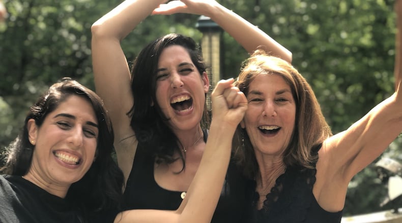 Emily Green (center) celebrates with her sister Clara (left) and their mother, Amy Totenberg, after learning about Emily’s Pulitzer win. CONTRIBUTED: EMILY GREEN
