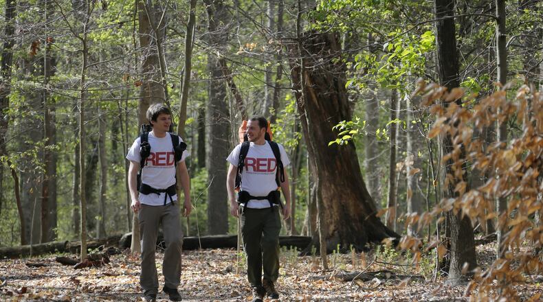 Marietta resident Kolya Schubert and Brookhaven resident Marc-Antoine Davoust will spend five or six months trekking along the Pacific Crest Trail (roughly 2,650 miles). One of their goals is to raise awareness for the Atlanta-based nonprofit RED (Rehabilitation Enables Dreams), which provides programs for young, first-time, nonviolent criminal offenders. They’re shown hiking in Brook Run Park in Dunwoody. BOB ANDRES /BANDRES@AJC.COM