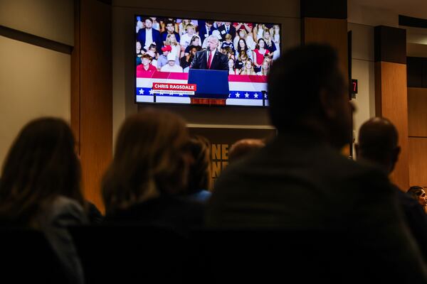 A video from President Donald Trump’s visit to Wheeler High School is played during a Cobb County School Board Meeting in Marietta in July. (Abbey Cutrer/AJC)