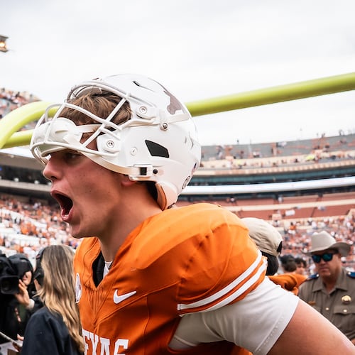 Texas Longhorns quarterback Arch Manning (16) celebrates the team's win over Vanderbilt during an NCAA college football game in Austin, Texas, Saturday, Nov. 1, 2025. (Sara Diggins/Austin American-Statesman via AP)