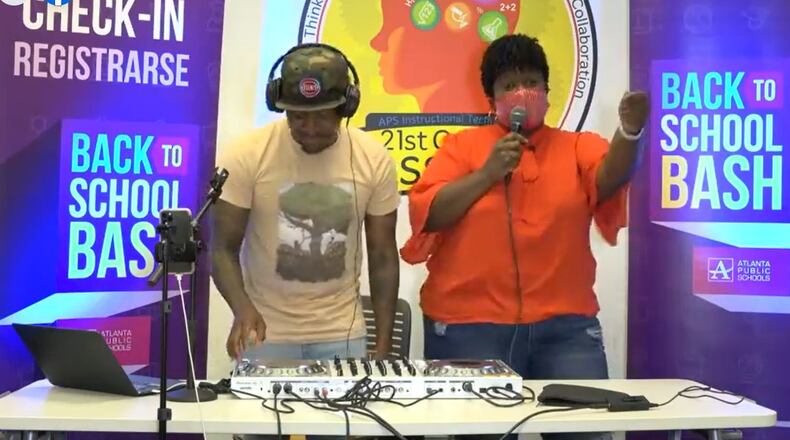 Atlanta Public Schools Superintendent Lisa Herring, right, is shown dancing in this screenshot taken during the district's Facebook live dance party Friday.