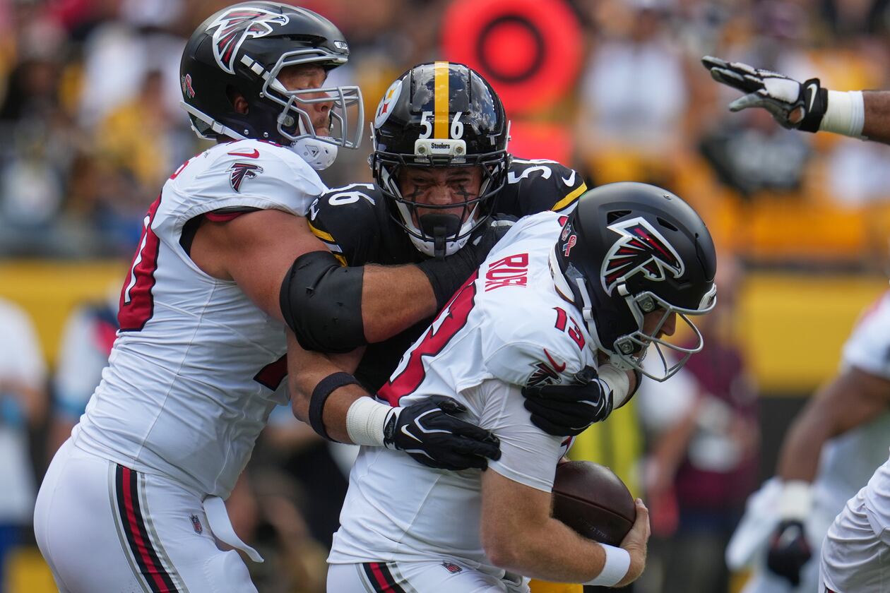 Falcons quarterback Cooper Rush (13) is sacked by Pittsburgh Steelers linebacker Alex Highsmith (56) during an NFL football game Sunday, Sept. 13, 2026, in Pittsburgh. (AP Photo/Gene J. Puskar)