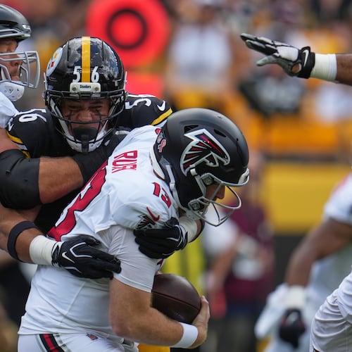 Falcons quarterback Cooper Rush (13) is sacked by Pittsburgh Steelers linebacker Alex Highsmith (56) during an NFL football game Sunday, Sept. 13, 2026, in Pittsburgh. (AP Photo/Gene J. Puskar)