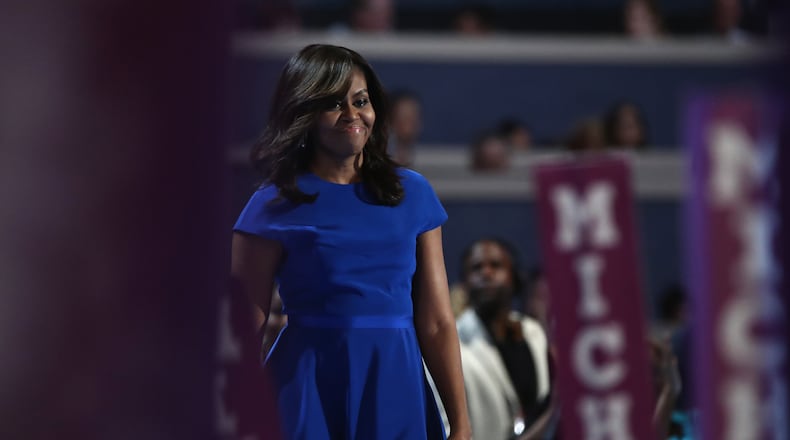 PHILADELPHIA, PA - JULY 25: First lady Michelle Obama walks on stage before delivering remarks on the first day of the Democratic National Convention at the Wells Fargo Center, July 25, 2016 in Philadelphia, Pennsylvania. An estimated 50,000 people are expected in Philadelphia, including hundreds of protesters and members of the media. The four-day Democratic National Convention kicked off July 25. (Photo by Jessica Kourkounis/Getty Images)