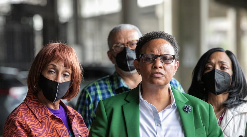 The 11th Circuit Court of Appeals on Wednesday denied a quest for a new trial for former Atlanta official Mitzi Bickers (pictured here in green blazer). (Jenni Girtman for The Atlanta Journal-Constitution)