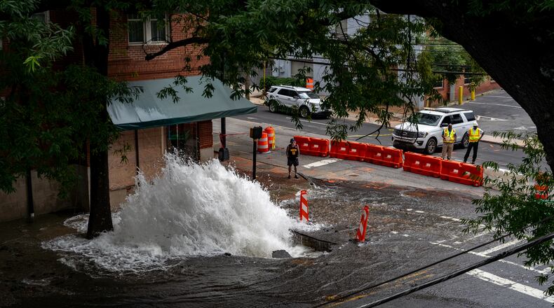 Water continued to flood out two days after a major water main broke near the intersection of 11th and West Peachtree streets in June. The geyser spewed for days after key shut-off valves in Midtown failed. Atlanta officials say the city wasn't doing enough to ensure the equipment would work in a crisis. Sunday, June 2nd, 2024 (Ben Hendren for the Atlanta Journal-Constitution)
