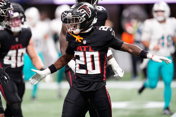 Falcons cornerback Dee Alford celebrates his sack of Dolphins quarterback Tua Tagovailoa.