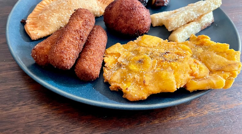 This sampler at Miami-style D' Cuban Cafe offers an array of Cuban specialties. Angela Hansberger for The Atlanta Journal-Constitution