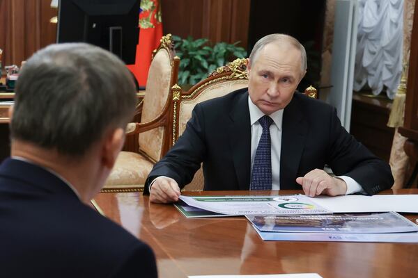 Russian President Vladimir Putin meets with Leningrad Region Governor Alexander Drozdenko at the Kremlin in Moscow, Russia, Friday, March 28, 2025. (Vyacheslav Prokofyev, Sputnik, Kremlin Pool Photo via AP)