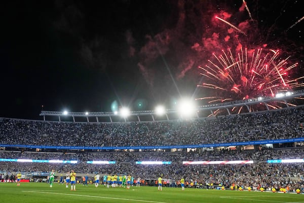 Fireworks explode after Argentina defeated Brazil and secured a spot for the World Cup 2026 in a qualifying match at Monumental Stadium in Buenos Aires, Argentina, Tuesday, March 25, 2025. (AP Photo/Natacha Pisarenko)