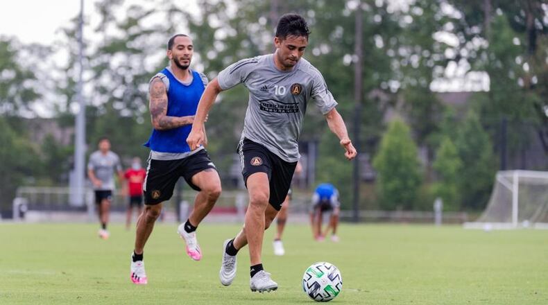 Atlanta United midfielder Pity Martinez dribbles the ball during full team training at Children's Healthcare of Atlanta Training Ground in Marietta, Ga., on Tuesday June 9, 2020.