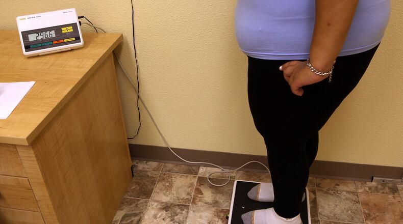 This 17-year-old girl stands on a scale during her weekly weigh-in at the Wellspring Academy in Reedley, California. Struggling with her weight, she enrolled at the Wellspring Academy, a special school that helps teens and college level students lose weight while getting an education.