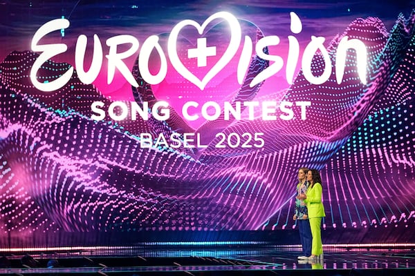 Hosts Hazel Brugger, left and Sandra Studer, on stage during the first semi-final of the 69th Eurovision Song Contest, in Basel, Switzerland, Tuesday, May 13, 2025. (AP Photo/Martin Meissner)