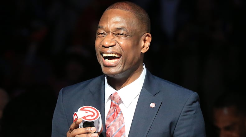 Hawks Legend Dikembe Mutombo is all smiles as he has his No. 55 jersey retired by the Hawks during half time in a basketball game against the Celtics on Tuesday, Nov. 24, 2015, in Atlanta.  Curtis Compton / ccompton@ajc.com