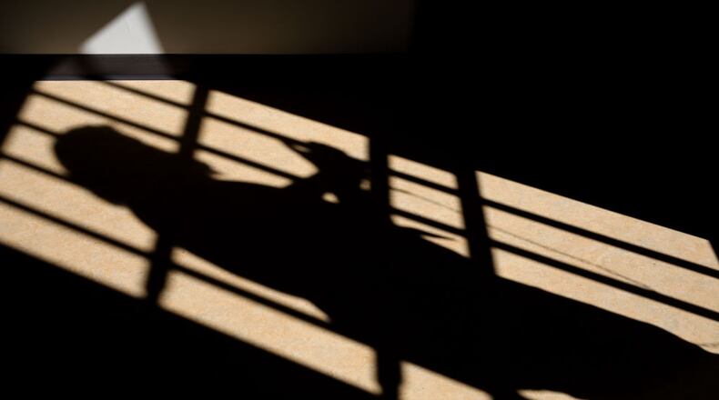 A shadow is cast of a prison cell door. (Photo: Dan Kitwood/Getty Images)