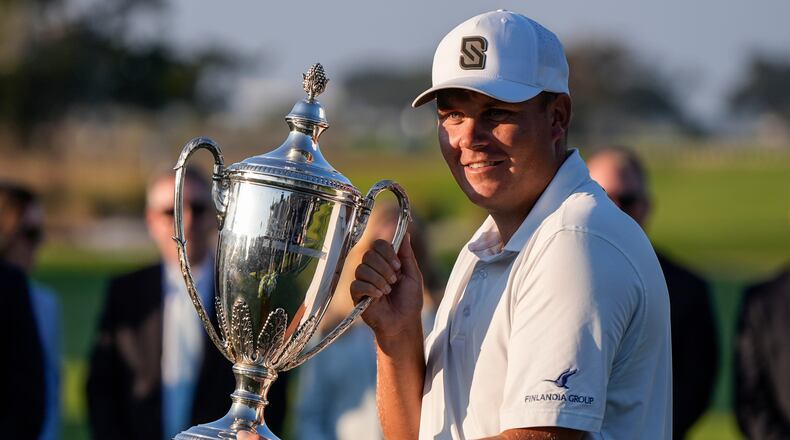 Sami Valimaki celebrates on the 18th green during the final round of the RSM Classic golf tournament, Sunday, Nov. 23, 2025, in St. Simons Island, Ga. (AP Photo/Mike Stewart)