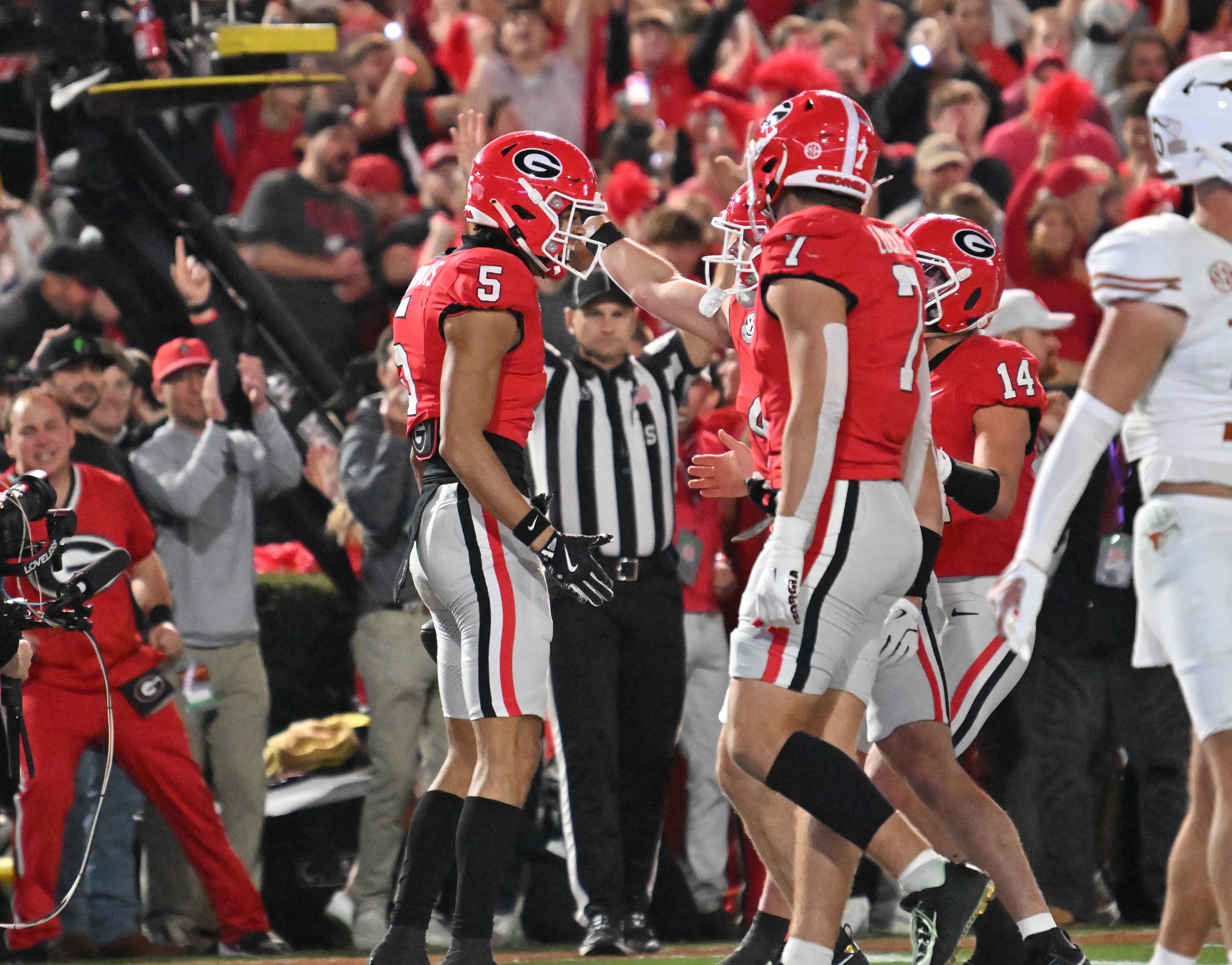 Georgia wide receiver Noah Thomas (5) celebrates with teammates after scoring a touchdown during the first half in an NCAA football game at Sanford Stadium, Saturday, November 15, 2025, in Athens. (Hyosub Shin / AJC)