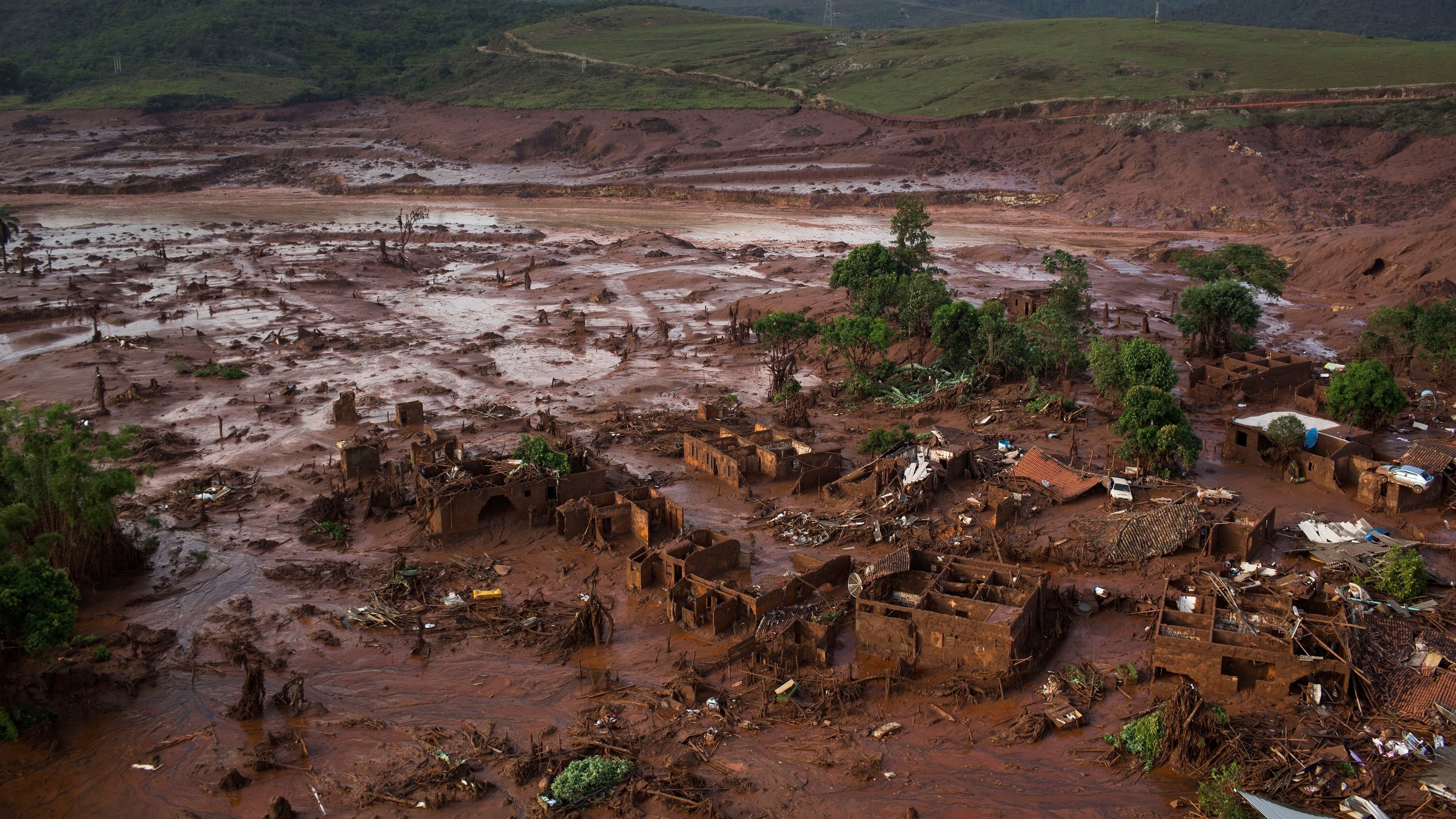 FILE - Debris is visible after a dam burst at the small town of Bento Rodrigues in Minas Gerais state, Brazil, Nov. 6, 2015. (AP Photo/Felipe Dana, File)