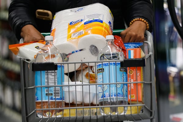 Georgia State University employee Rene Mondy stocks up on supplies before the potential winter storm at Azalea Fresh Market in downtown Atlanta on Thursday, Jan. 22, 2026. (Abbey Cutrer/AJC)