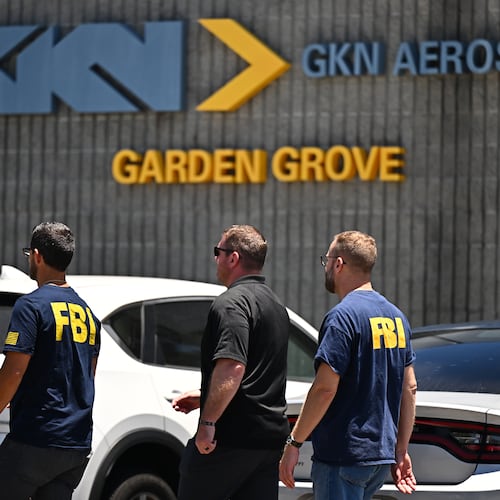 FBI agents work around GKN Aerospace in Garden Grove, Calif. on Wednesday, June 10, 2026. (AP Photo/William Liang)