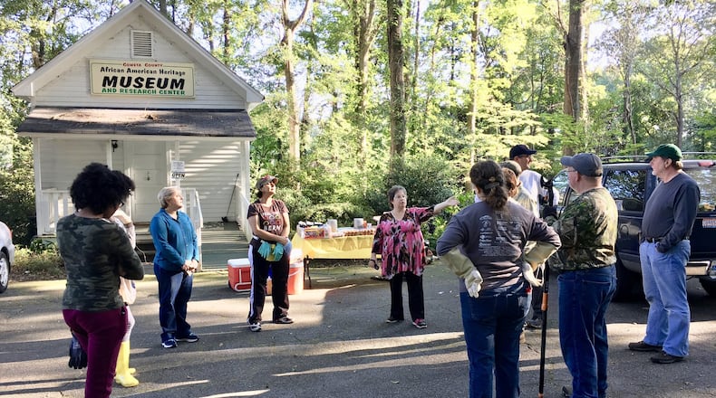 Dianne Wood (center) meets with members of South Atlanta Progress before they begin work at the Coweta County African-American Heritage Museum earlier this month. Wood is museum treasurer and researcher. CONTRIBUTED