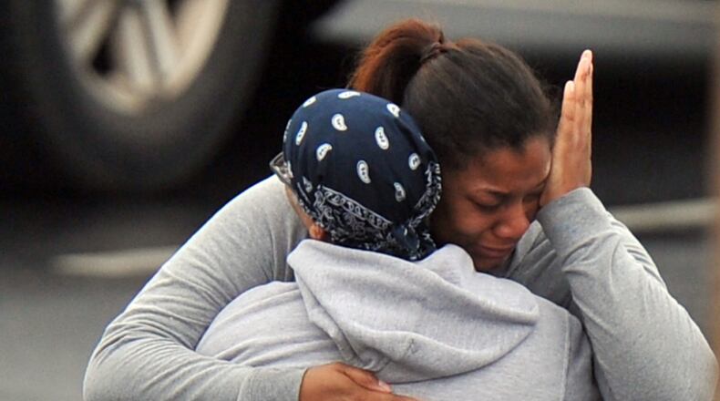 FedEx Employees and family members gathered at a near by skating rink following a shooting Tuesday morning at the shipping facility.