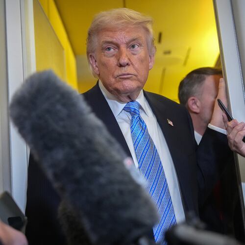 President Donald Trump speaks to reporters aboard Air Force One, Friday, May 15, 2026, as he returns from a trip to Beijing, China. (AP Photo/Mark Schiefelbein)