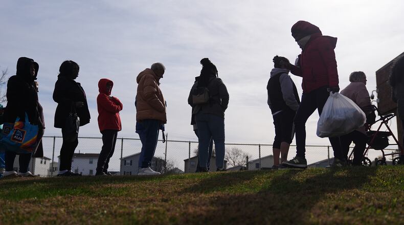 People wait in line durning an emergency food distribution at The Jewish Federation of Greater Philadelphia's Mitzvah Food Program in Philadelphia, Friday, Nov. 7, 2025. (AP Photo/Matt Rourke)