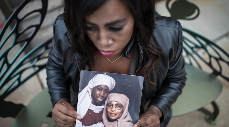 Joy Fluker poses for a portrait holding a photo of her and her mother, Anna Elizabeth Young, who was arrested for killing a young boy in Florida, Thursday, Dec. 7, 2017, in Woodstock, Ga.  BRANDEN CAMP/SPECIAL