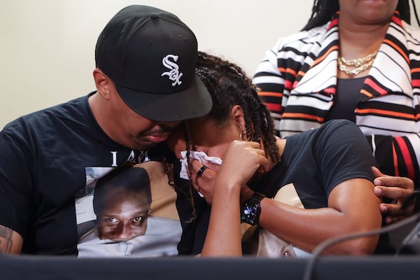 Darlene Chaney, cousin of Cornelius Taylor, is embraced by her brother Derek Chaney during a press conference announicng a lawsuit against the City of Atlanta for Taylor’s death on Friday, July 18, 2025. Taylor was killed in his tent by heavy construction equipment during a sweep of the homeless encampment. (Natrice Miller/ AJC)
