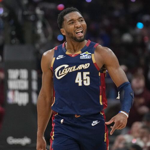 Cleveland Cavaliers guard Donovan Mitchell (45) gestures to the crowd in the first half in Game 2 of a first-round NBA basketball playoffs series against the Toronto Raptors in Cleveland, Monday, April 20, 2026. (AP Photo/Sue Ogrocki)