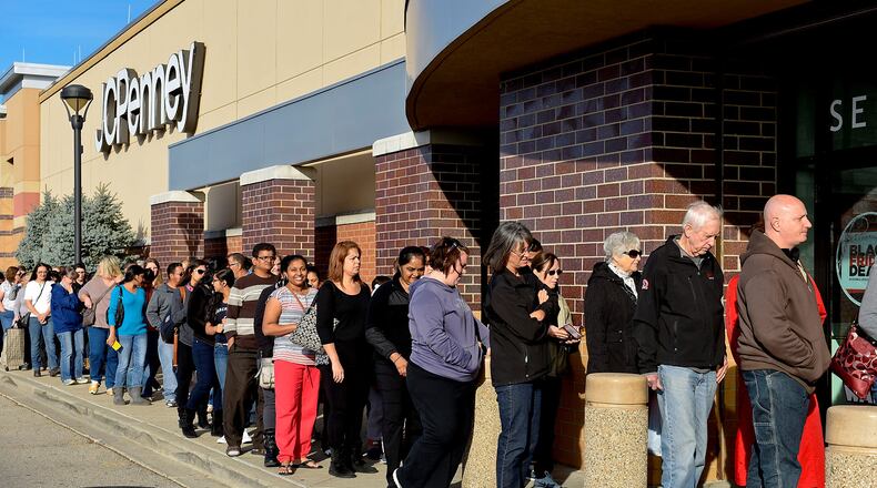 Shoppers wait in line outside the JC Penny store at Bridgewater Falls to take advantage of the pre-Black Friday sales on Thanksgiving Day Thursday, Nov. 26 in Fairfield Township. There were almost 200 people in line when the store opened at 3 p.m. NICK GRAHAM/STAFF