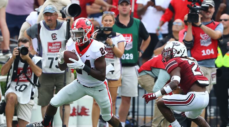 Georgia defensive back Malaki Starks intercepts a Spencer Rattler pass intended for South Carolina running back Juju McDowell and makes a long return setting up a Georgia scoring drive during the first quarter in a NCAA college football game on Saturday, Sept. 17, 2022, in Columbia. Curtis Compton / Curtis Compton@ajc.com