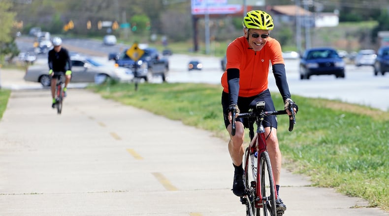 Bill Clineburg takes advantage of the sunshine and bikes on the Silver Comet Trail on Wednesday, March 25,  2020, at the Silver Comet Trail Connector in Smyrna, Georgia. Temperatures were warm throughout the metro Atlanta area reaching a high of 72 degrees, according to WSB-TV Meteorologist Brian Monahan. (Christina Matacotta, for The Atlanta Journal-Constitution)