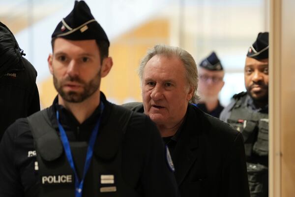 French actor Gerard Depardieu leaves for a break during his trial for the alleged sexual assaults of two women on a film set in 2021, Wednesday, March 26, 2025 in Paris. (AP Photo/Aurelien Morissard)
