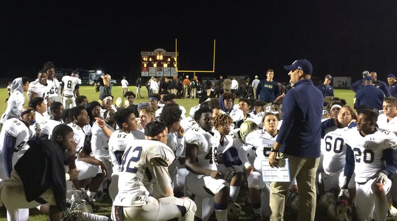 Dacula coach Tommy Jones talks to his players after the 41-7 win over Lanier.