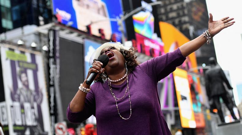 Broadway performer Lilias White participates in "We Will Be Back," a live pop-up event and commemoration of Broadway's "lost year" at Times Square on March 12 in New York. The Times Square New Year's Eve party was canceled for 2021 but will return on Dec. 31 to ring in 2022. (Angela Weiss/AFP via Getty Images/TNS)