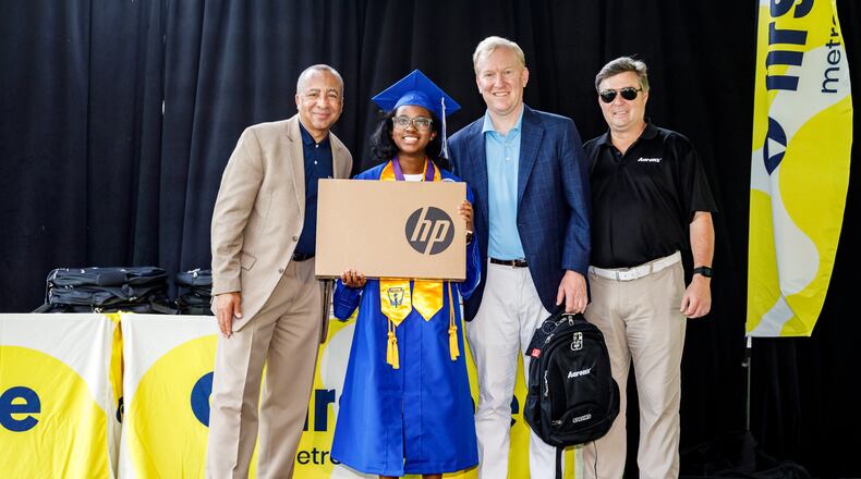 First Tee – Metro Atlanta executive director Marvin Hightower, First Tee graduate Ana Herndon, The Aaron's Company CEO Douglas Lindsay and The Aaron's Company Vice President of Corporate Communications & Investor Relations Mike Dickerson stand at the First Tee Metro Atlanta Participant Celebration at the John A. White Park Golf Course where The Aaron's Company provided new laptops to all 16 FTMA graduating seniors. Courtesy of Karl L. Moore/Mooreshots LLC